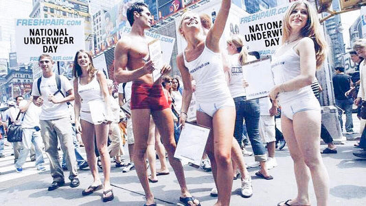 Group of men and women on city street celebrating National Underwear Day Founded by Freshpair